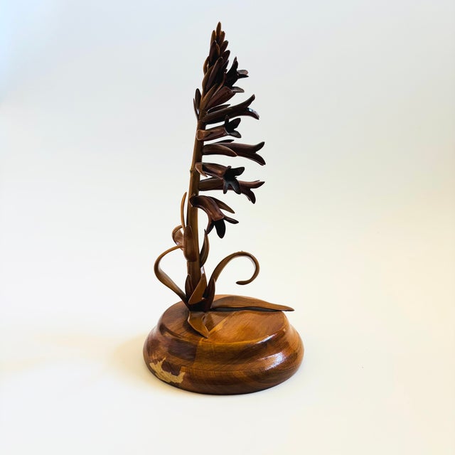 A vintage hand carved wood flower sculpture. Meticulous attention to detail using a variety of woods to create the flower...