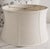 A large-scale neutral fabric lamp shade featuring a softly curved silhouette and tailored mid-century construction....