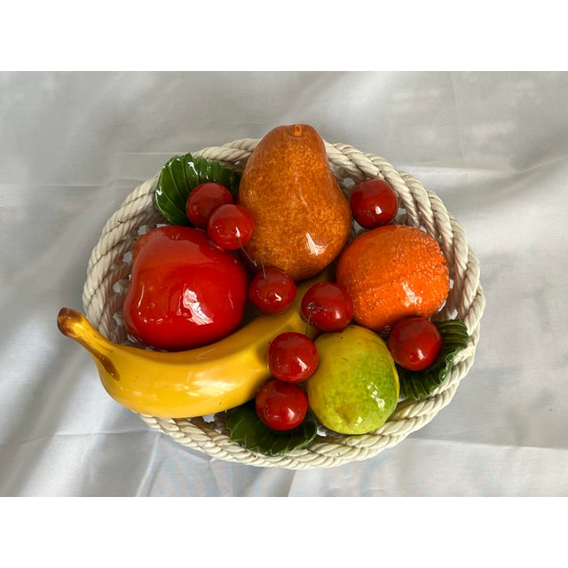 Charming Italian ceramic fruit bowl featuring brightly painted, life size apple, banana, orange, lemon, pear, cherries and...
