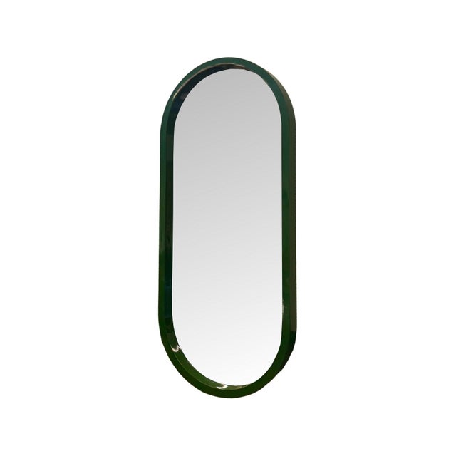 The Osman Mirror features an elegant elongated oval shape with softly rounded edges, offering a clean, modern silhouette...