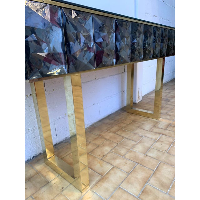 Contemporary console, full brass and large pieces of grey Murano glass with relief diamond point. Small artisanal...