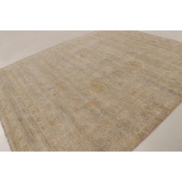 This oversized 12x15 contemporary Oushak rug represents a masterful addition to Rug & Kilim’s Modern Classics collection—a...