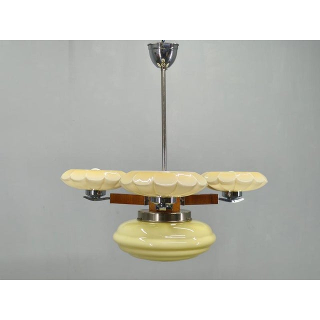 Exceptional art deco chandelier produced in czechoslovakia during the 1940s. This striking ceiling fixture showcases the...