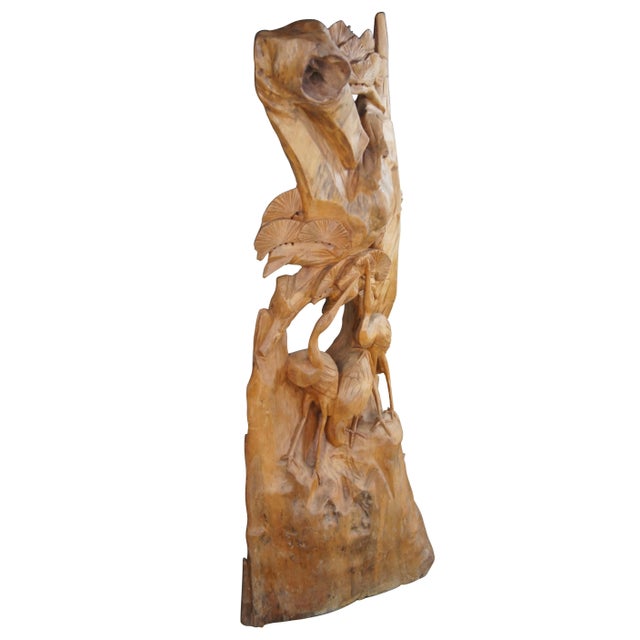 Hand Carved heron wildlife scene. The tree features three herons towards the base stretching upwards towards foliate....