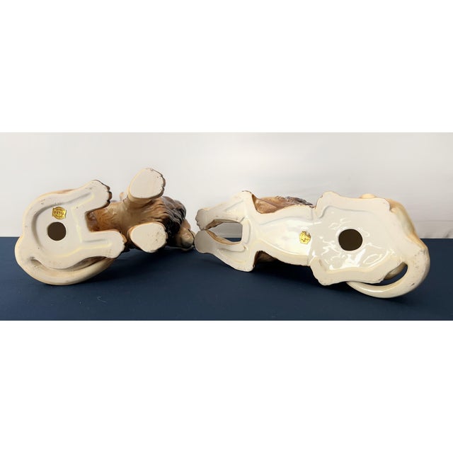 Striking vintage pair of hand painted ceramic lion figurines by Tilso Japan, featuring one seated lion and one reclining...