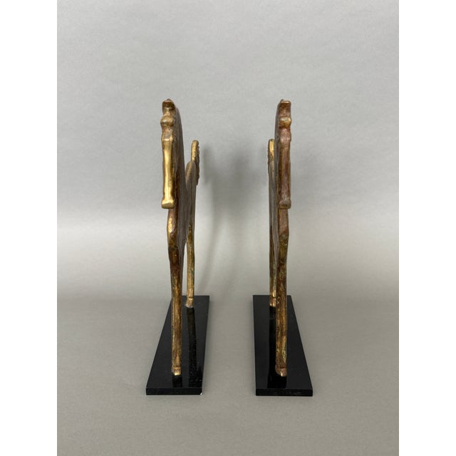 These stunning bronze horse sculptures may be displayed individually or as book ends. They are very heavy for their size....