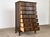 A dark-stained solid oak serpentine tallboy chest of drawers in the Danish Baroque Revival tradition — the work of an...