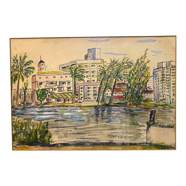 A vintage painting of Miami Beach, circa 1950, in an ivory colored frame with mat.