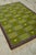 A beautiful green, purple and brown shaded rug in a design called "Garden" by Berit Koenig Woelfer for Swedish Rug...
