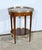 This serving table opens with a drawer with a finely crafted lens button. The belt is inlaid. The circular top also...