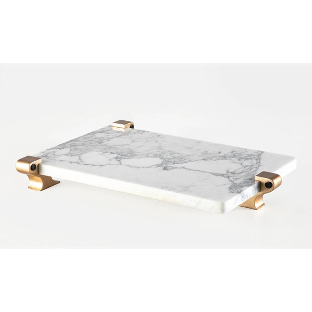 Handcrafted decorative Carrara marble tray,with 3 or 4 gold-plated wooden legs. This elegant tray give you a taste of...