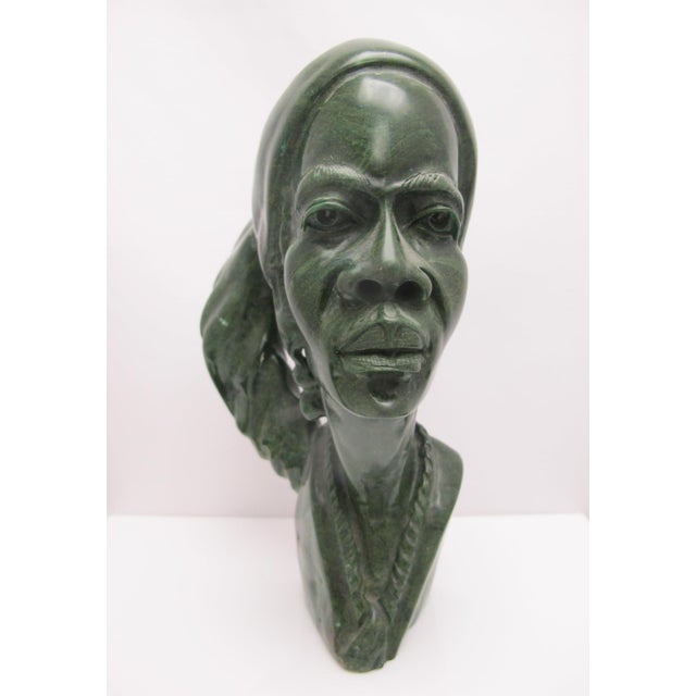 Hand carved by Zimbabwean artist, J Chirunga Shona Tribe sculpture. Large figural bust depicting an African woman with...