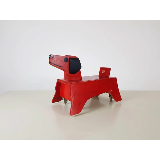 Just look at this happy vintage dog from the 1950s. This post-war wooden dog on wheels was made and designed by German toy...