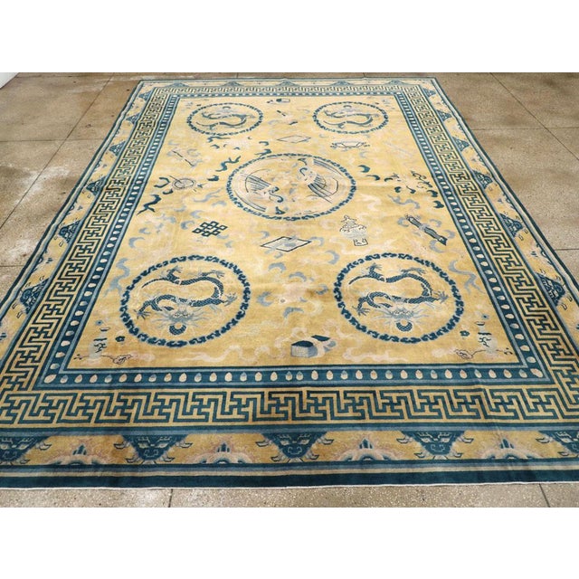 An antique Chinese Peking large room size carpet handmade during the early 20th century. Measures: 10' 10" x 15' 2".