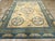 An antique Chinese Peking large room size carpet handmade during the early 20th century. Measures: 10' 10" x 15' 2".