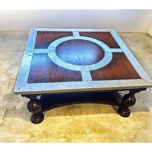 Shoreditch Mahogany & Metal Industrial Coffee Table—rugged industrial edge meets old-world craftsmanship. This striking...