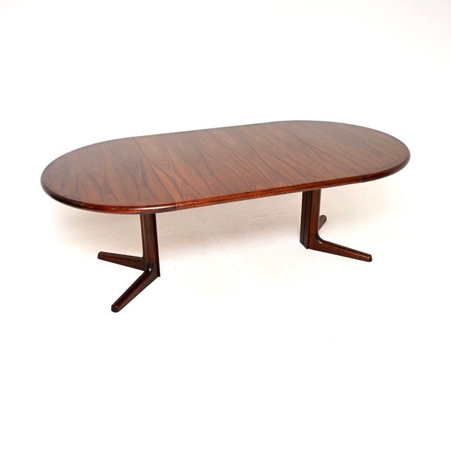 A very stylish and top quality Danish vintage extending dining table. This was made in Denmark by Dyrlund, it dates from...