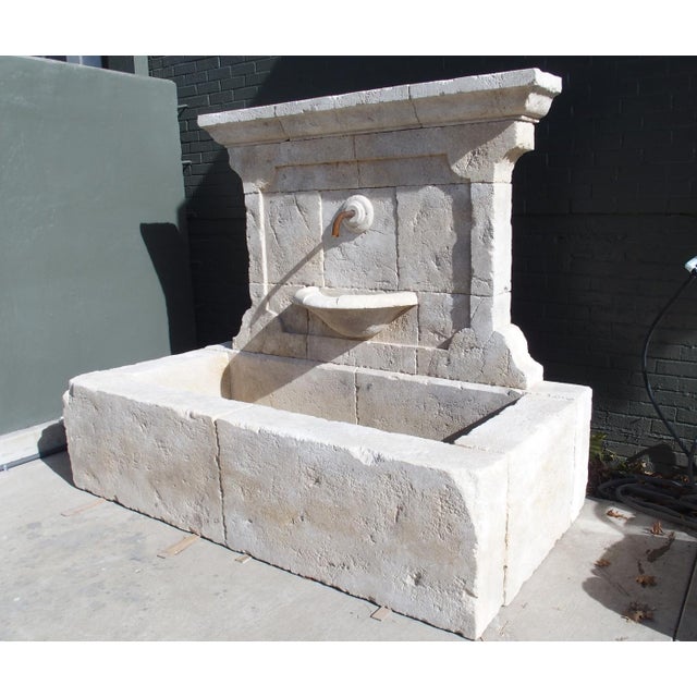 More information coming soon… Comprised of 17 pieces of hand-carved French limestone, this large wall fountain features a...