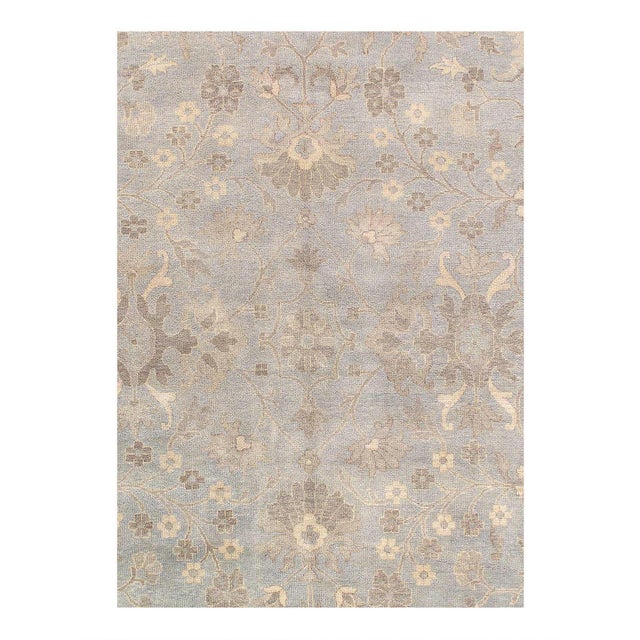 This Oushak Hand-Knotted Wool Gray Area Rug celebrated for its understated elegance, is greatly influenced by original...