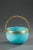 Basket-shaped cup in blue opaline decorated with gilded festoons and stripes. The gilded and sculpted bronze handle is in...