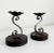 A pair of 1970's Spanish Revival, brutalist-style candle holders featuring rough-hewn wood with dark stain, stems made of...