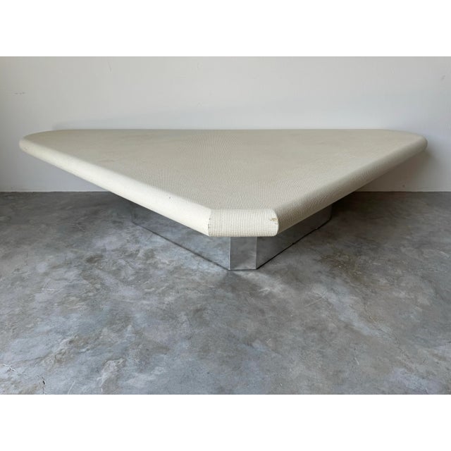 A large and impressive triangular coffee table attributed to Karl Springer. We are delighted to offer for sale this...