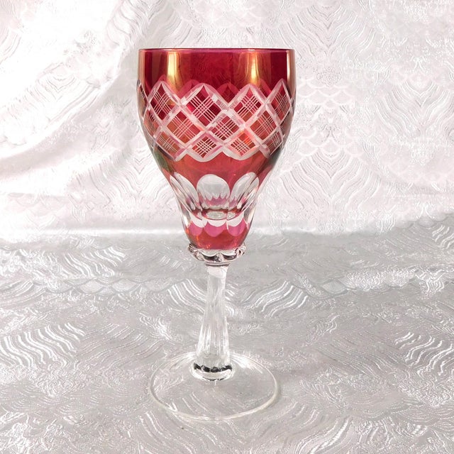 This is a set of four matching pink cut to clear stemware glasses. The glasses have no stickers or makings on them, and I...