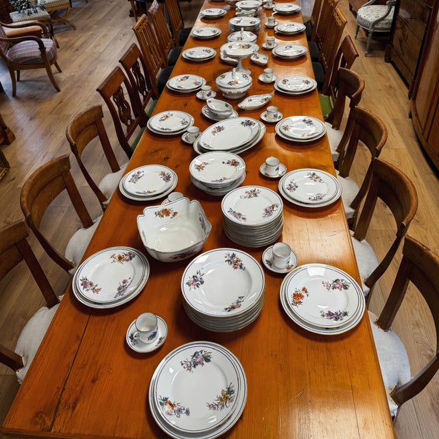 Immerse yourself in the elegance of bygone times with this exquisite antique porcelain service from around 1900-1920....