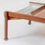 A coffee table by Ico Parisi. Featuring two sliding glass tops to access magazine shelves.