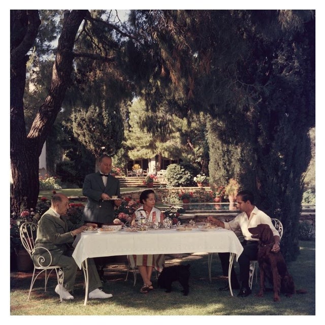 Al Fresco Tea 1961 Colonel Dimitris Levidis enjoying a meal in the fresh air at Harvati with his wife and son, July 1961....