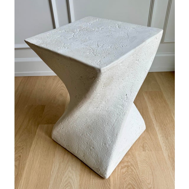 Vintage postmodern sculptural side table or pedestal featuring a twisted hourglass form and heavily textured plaster...