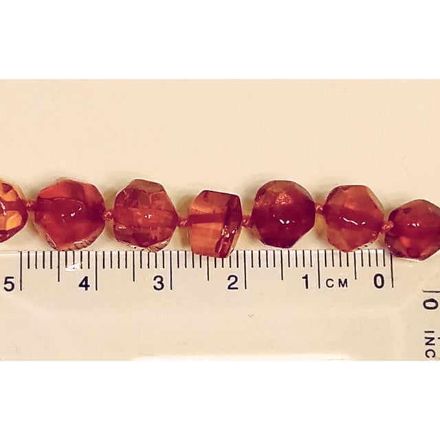 Ladies' 16" Baltic Amber Necklace: A Unique Handcrafted Treasure This exquisite necklace features Baltic Amber beads...