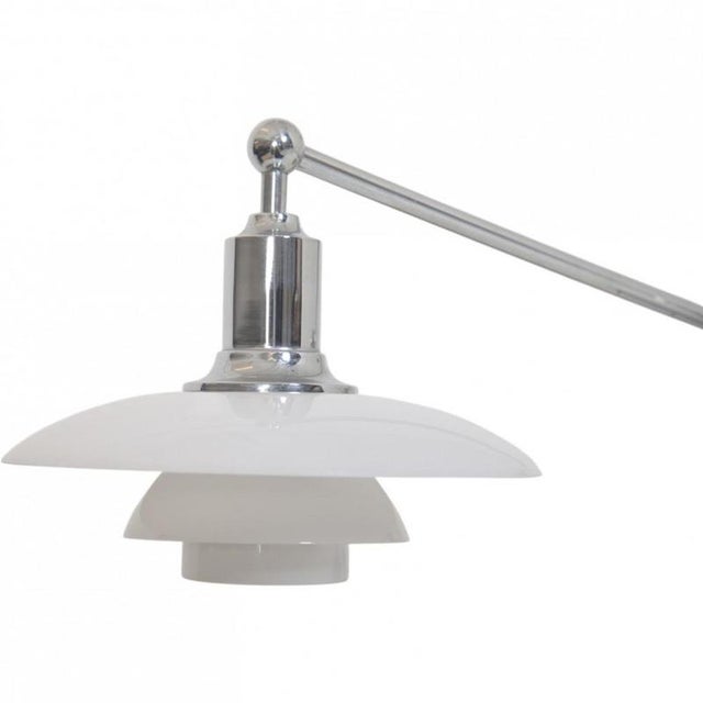 Poul henningsen ph2/1 piano lamp with a chrome frame and white opal glass shades. The lamp is from the 1990s and appears...