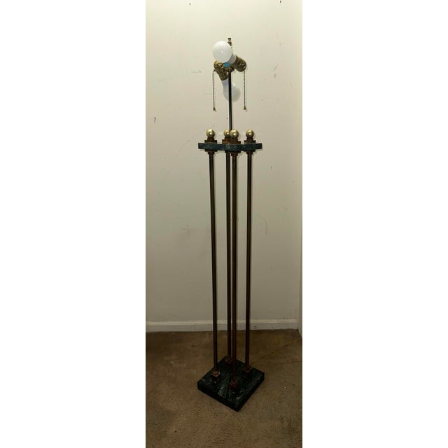 Sophisticated and stately, this mid-century modern Hollywood Regency floor lamp features an architectural design composed...