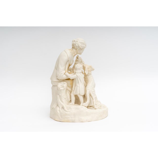 This fine English figural composition dates to the late Edwardian period and it features a maiden and child, together with...