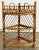 Vintage scorched bamboo tiered triangular corner shelf with rounded front. Top shelf features split reed top. Distance...