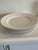 Set of six large white porcelain service or dinner plate plates. Plate stands not included.
