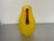 Contemporary Sam Stag Blown Glass pitcher, vivid yellow with maroonish handle. Each of his pieces are unique.