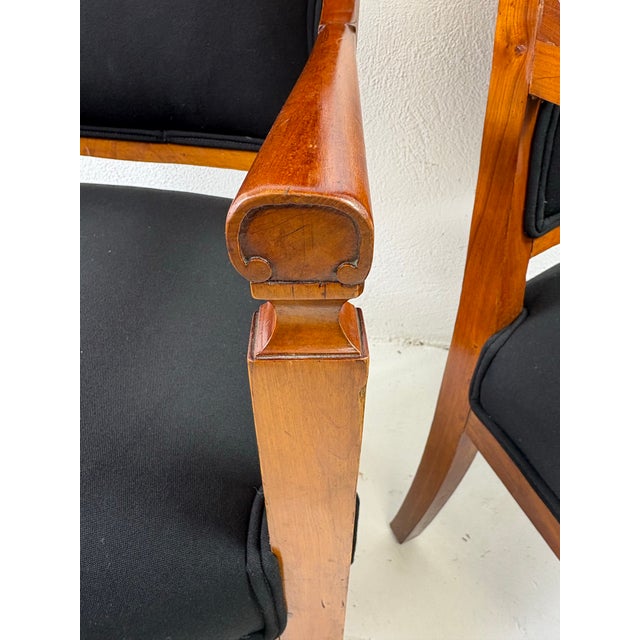 This is a pair of antique Scandinavian Biedermeier armchairs. This exceptional pair of Biedermeier chairs have handcrafted...