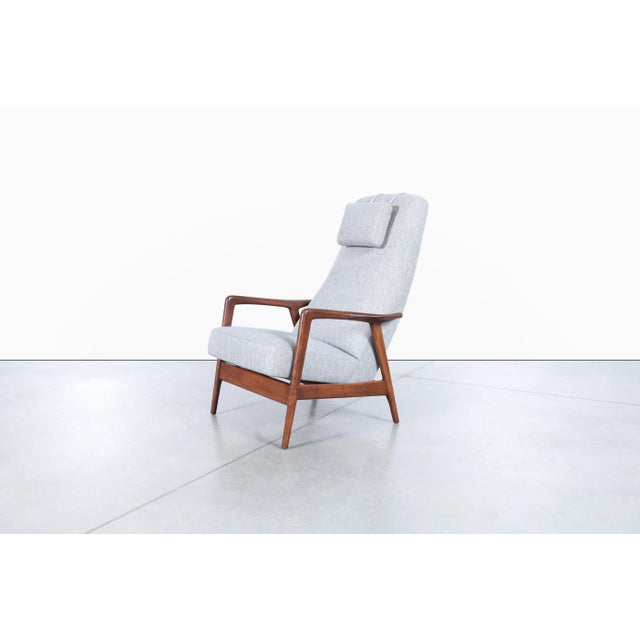 Mid-century modern walnut reclining lounge chair designed by Alf Svensson for Dux, Sweden, circa 1960s. This exceptional...