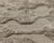 A field of pebbles, sculpted in wool. This hand-knotted Moroccan wool rug features an organic pattern of rounded, pebble-...