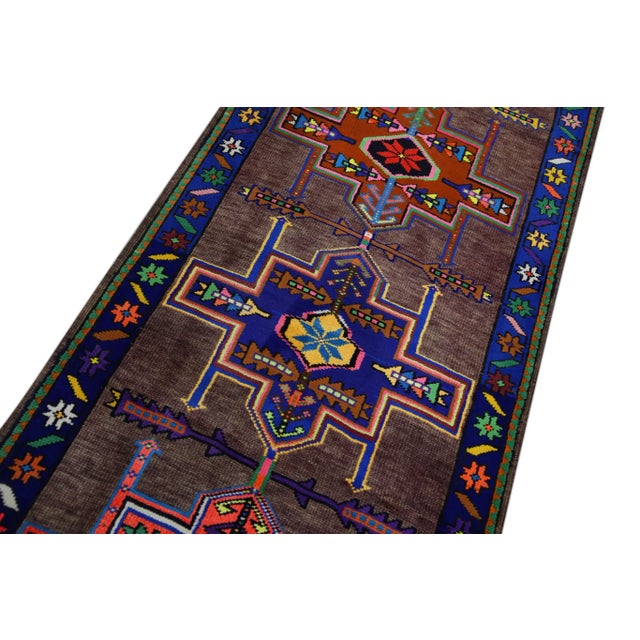 Introducing a one-of-a-kind vintage Turkish hand-knotted wool rug, carefully crafted by skilled artisans using traditional...