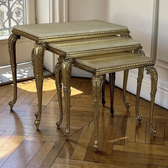 A delightful marriage of graceful French design and luxurious natural materials, this set of three nesting tables brings...