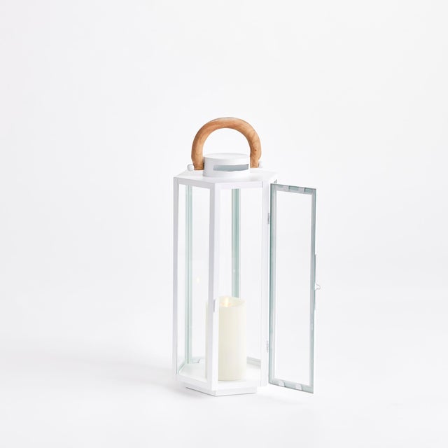 Nautical in style, this handsome outdoor lantern shines brilliantly in a chrome finish and real teak wood handle. Add a...