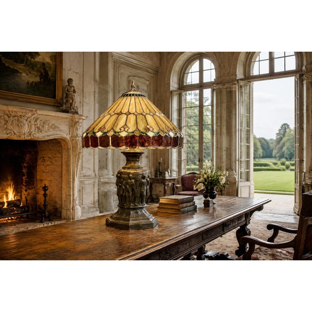 A massive 21" wide Tiffany-style leaded glass lamp shade. Its graceful, pointed conical form is composed of softly...