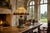 A massive 21" wide Tiffany-style leaded glass lamp shade. Its graceful, pointed conical form is composed of softly...