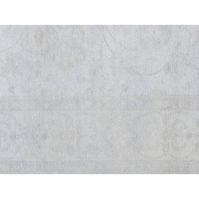 This vintage Egyptian Tabriz rug is handwoven with wool on a cotton foundation in Egypt’s Nile Delta region. Measuring...