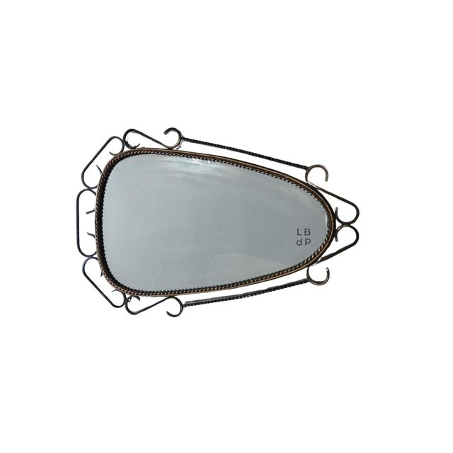 Antique wrought iron mirror. Brutalist style. Dating from the 1960s, this is a truly vintage piece. The antique wrought...