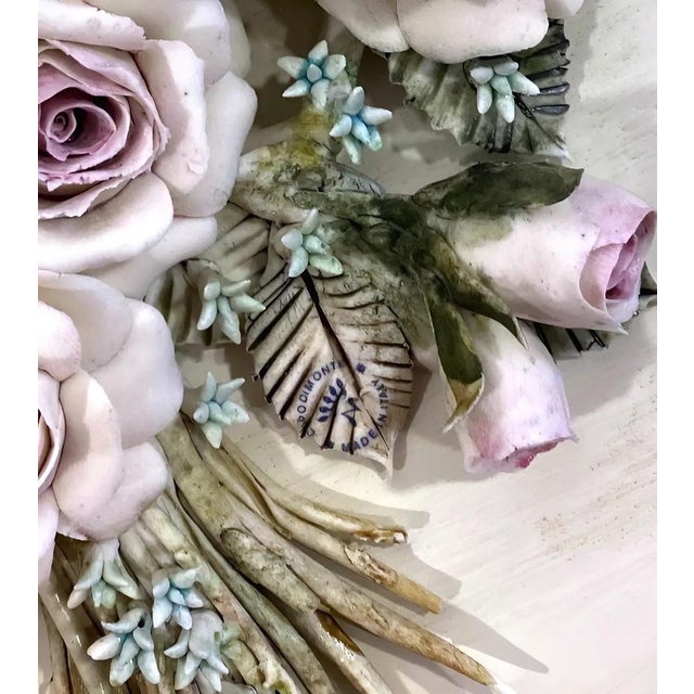 A stunning Capodimonte porcelain wall clock expertly handcrafted and painted by skilled Neapolitan artisans. Adorned with...