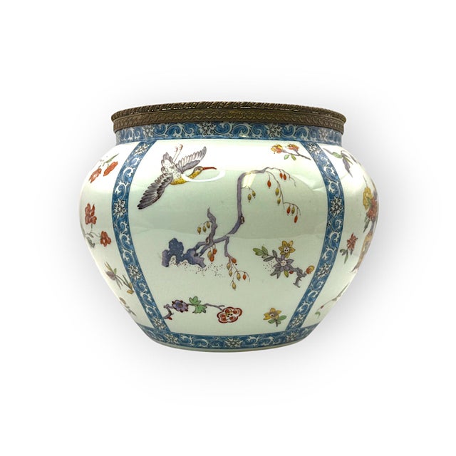 An elegant Limoges porcelain vase produced by B & Co, France, featuring refined Chinese-inspired decoration. The globular...